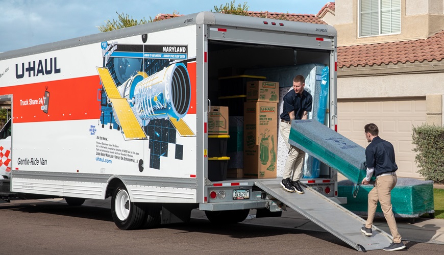 Labor-only movers loading a U-Haul truck.