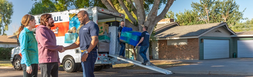 Moving Helpers shake hands with customers after a job is completed.